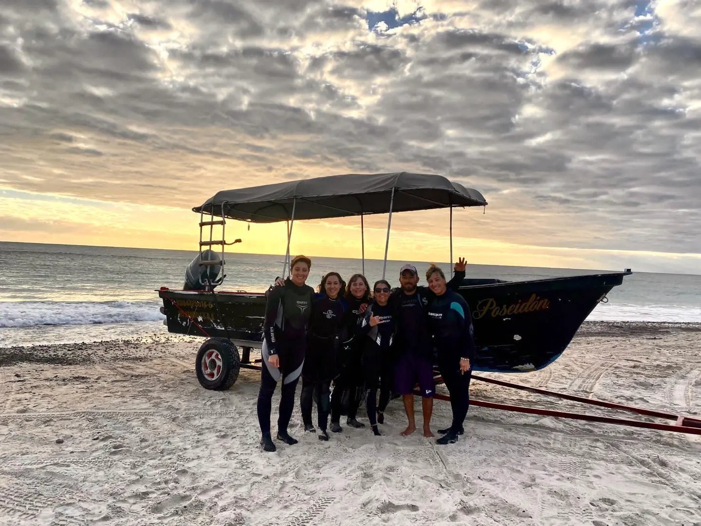 The Scuba Adventours team beside the panga before the first departure of the day
